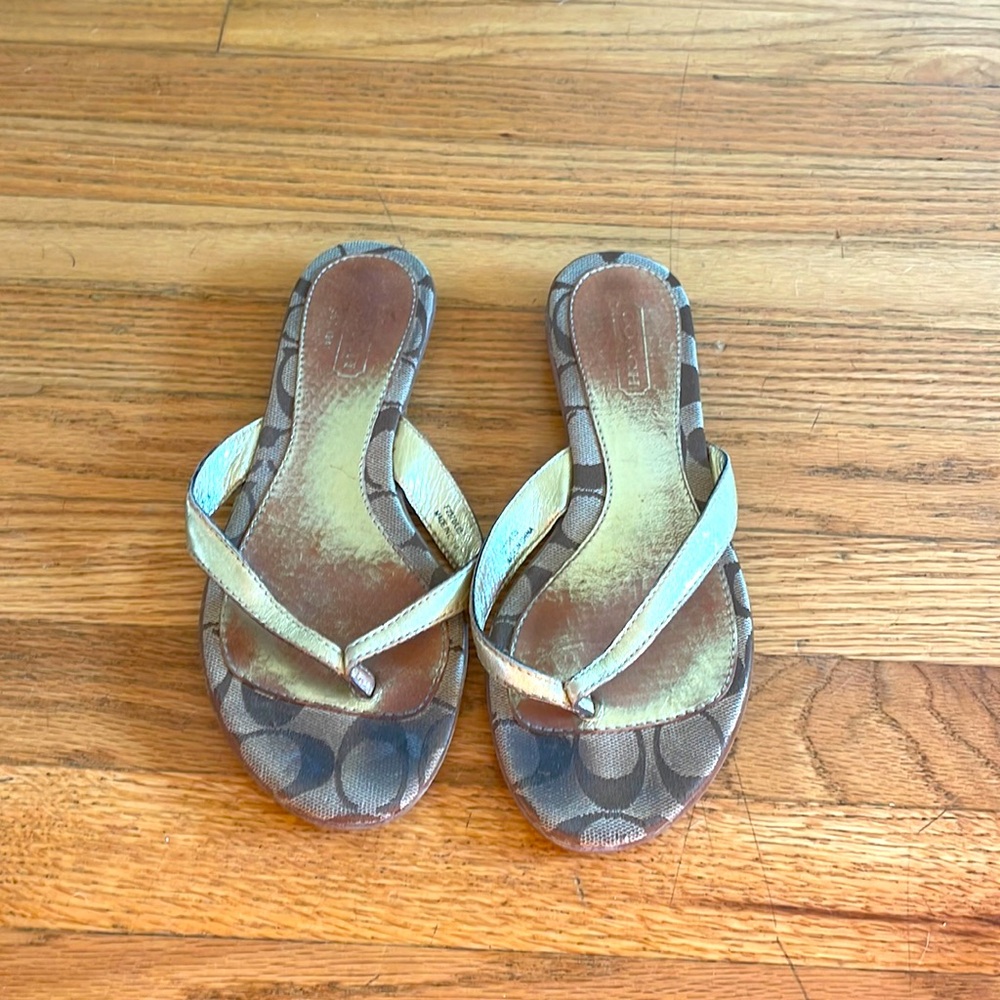 Coach flat flip-flops in gold
